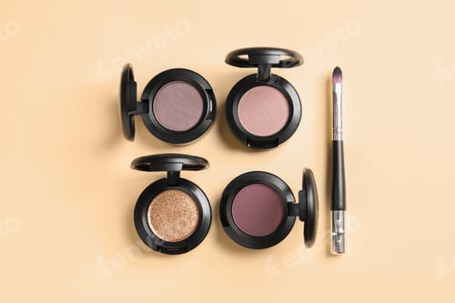 Preview: Flat lay composition with different eye shadows on color background