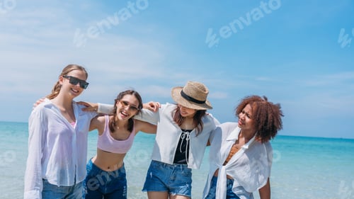 Preview: Happy children laughing and enjoying at beach. Teenage playing with friends at the sea.