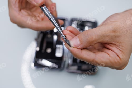 Preview: Men's hands manicure with professional clippers. A man gives himself a manicure