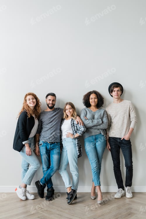 Preview: Five Young Adults Posing Against a Gray Wall