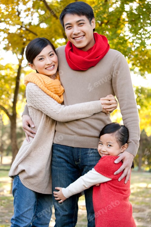 Preview: Young Family Enjoying a Park in Autumn
