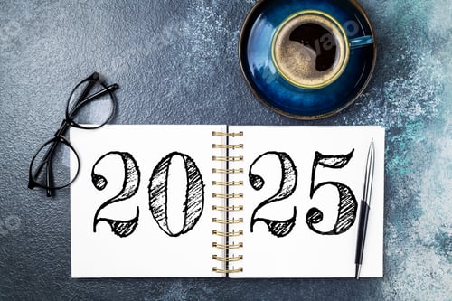Preview: New year resolutions 2025 on desk. 2025 resolutions list with notebook, coffee cup on blue table