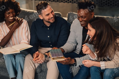 Preview: Group of interracial ecologists developing solar energy ideas at office