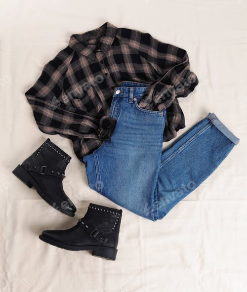 Preview: Flat lay composition with jeans, flannel shirt and shoes on white fabric
