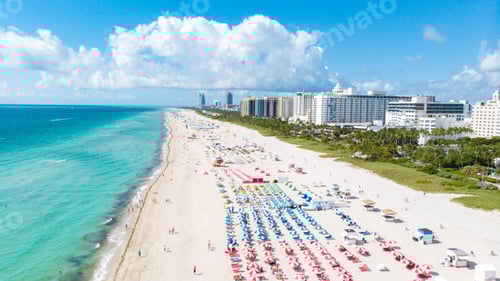 Preview: Drone aerial view at Miami South Beach Florida, Beach with colorful chairs and umbrellas