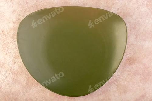 Preview: a top view green designed plate empty glass made on the pink background table dish meal