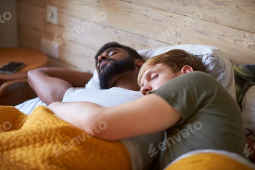 Preview: Loving Male Gay Couple Sleeping In Bed At Home Together