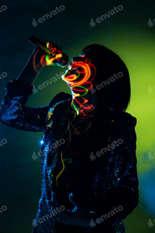 Preview: Stylish woman singing on stage