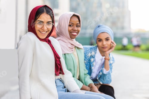 Preview: Beautiful muslim girl wearing hijab bonding outdoors