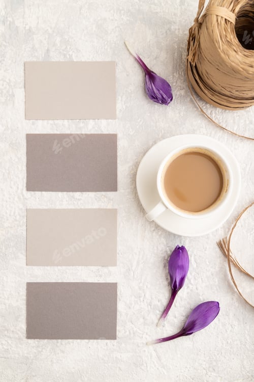 Preview: Gray paper business card mockup with spring snowdrop crocus flowers and cup of coffee