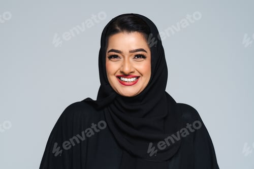 Preview: Beautiful arab middle-eastern woman with traditional abaya in studio