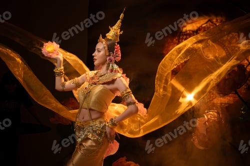 Preview: A beautiful woman in traditional Thai costume performing a classical dance
