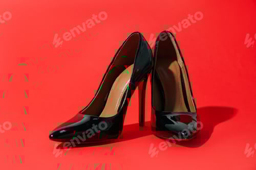 Preview: Elegant Black High Heel Shoes on Red Background