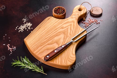 Preview: Cutting board with salt, spices and herbs on a dark concrete background
