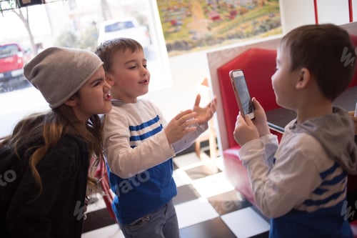 Preview: Kids chatting on mobile device with family