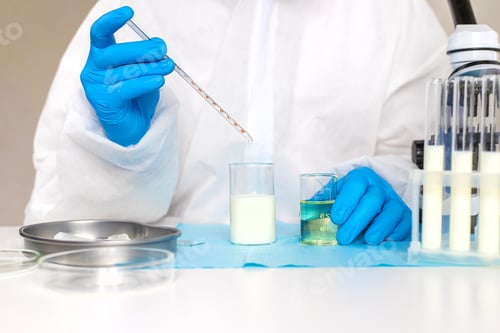 Preview: Examine milk in the laboratory. Selective focus.
