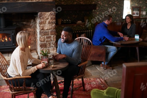 Preview: Couple Sitting At Table Drinking Tea In Traditional English Holiday Hotel