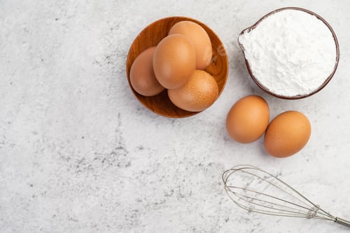 Preview: Eggs, tapioca flour in a cup and egg beater.