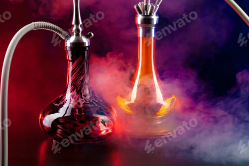 Preview: Modern hookah with smoke in dark club light