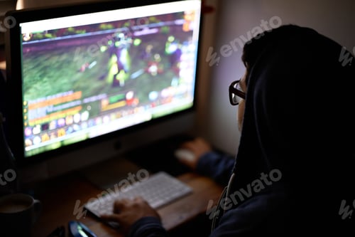 Preview: Working on a new game. Cropped shot of a young programmer focused on his work.