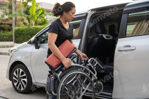 Preview: Asian disability woman on wheelchair getting in her car, Accessibility concept.