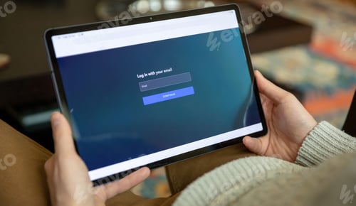 Preview: Log in with email, message on digital tablet. Male hand hold mobile device, home office work