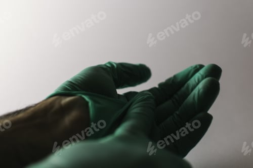 Preview: Doctor taking the medical gloves off after vaccination