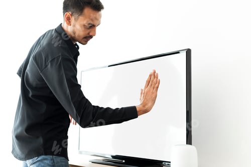 Preview: Man touching smart TV screen