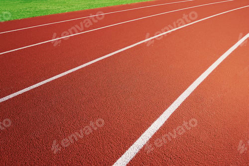 Preview: Red running track at stadium with border lanes