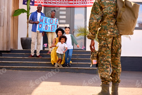 Preview: Multi-Generation Family Welcoming Army Father Home On Leave With Banner
