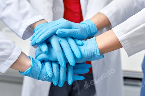 Preview: Hands in blue gloves covid, concept - creative team with hands on top of each other. Diverse team