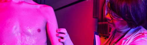 Preview: extraterrestrial life exploration, woman scientist examining alien in science center, banner