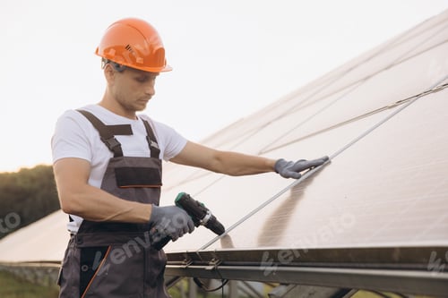 Preview: Young Technician Installing Solar Panels on a Sunny Day