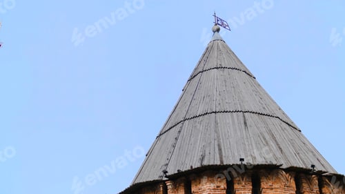 Preview: View of the wooden roof of the tower. Stock footage. Old red brick tower with wooden roof