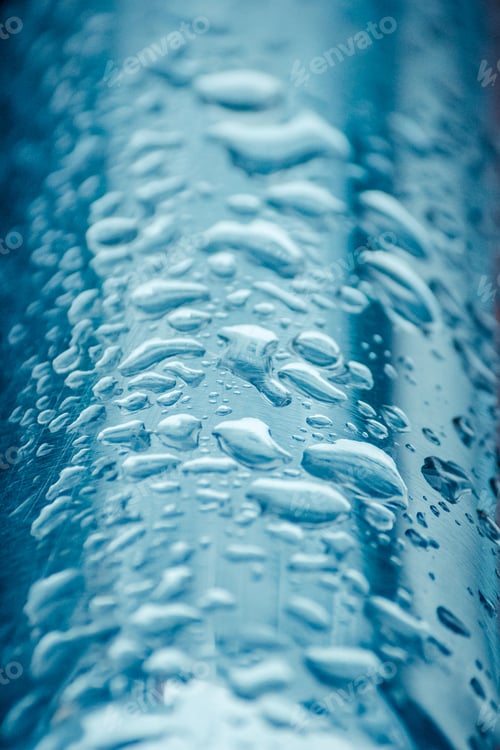 Preview: Water drop on metal surface. Close-up raindrop. Drops texture on blue background.