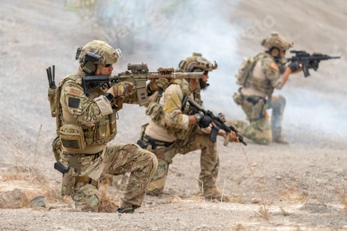 Preview: Close up one of soldier or military sit and point gun to the front of enemy with other in his team