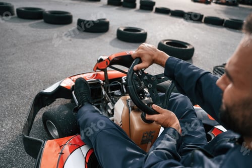 Preview: Parked, driving out. Man is outdoors, kart racing conception