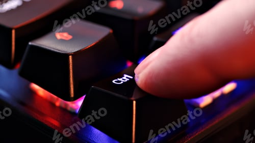 Preview: Human finger clicks on the control key on the computer keyboard, close up view.