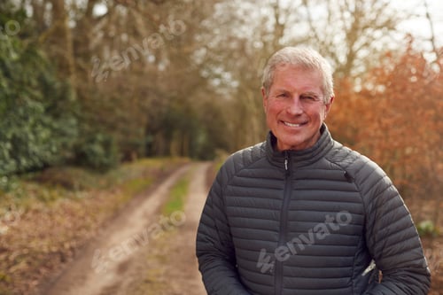 Preview: Portrait Of Smiling Senior man On Walk In Countryside Exercising During Covid 19 Lockdown