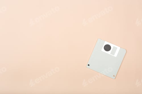 Preview: Old floppy disk placed on a plain surface during the day