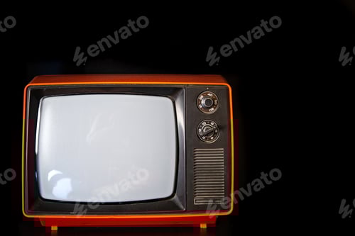 Preview: Vintage old TV close-up in a dark room.