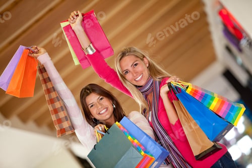Preview: Couple Of Women Shopping In A Mall With Some Bags