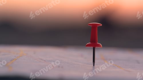 Preview: Close up red pin push map under sunset background. business focus and target concept.