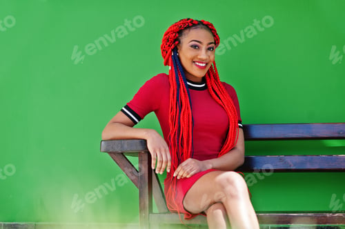 Preview: African american girl in red dress with dreadlocks