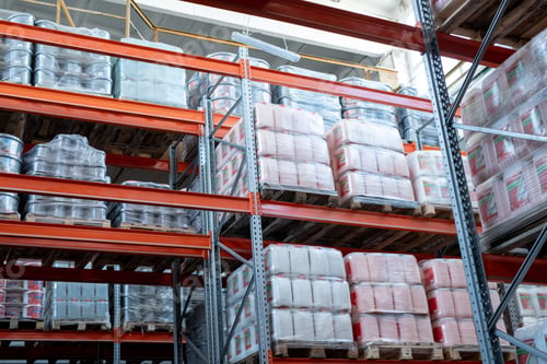 Preview: Metal frame shelves full of packed canisters and containers