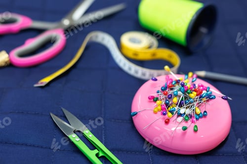 Preview: Sewing supplies on a blue background. View from above.