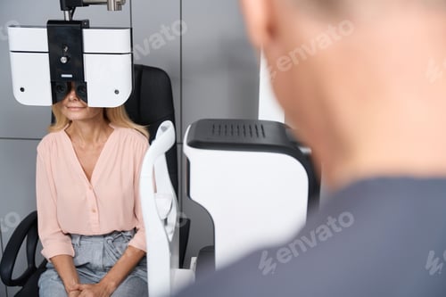 Preview: Woman sitting and having examination in clinic