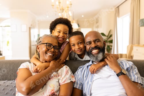 Preview: Smiling Family Together at Home on the Couch