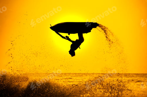 Preview: man drive freestyle jet ski at sunset.