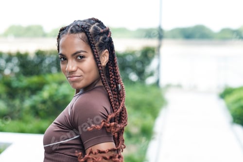 Preview: Natural portrait of young woman looking to camera.